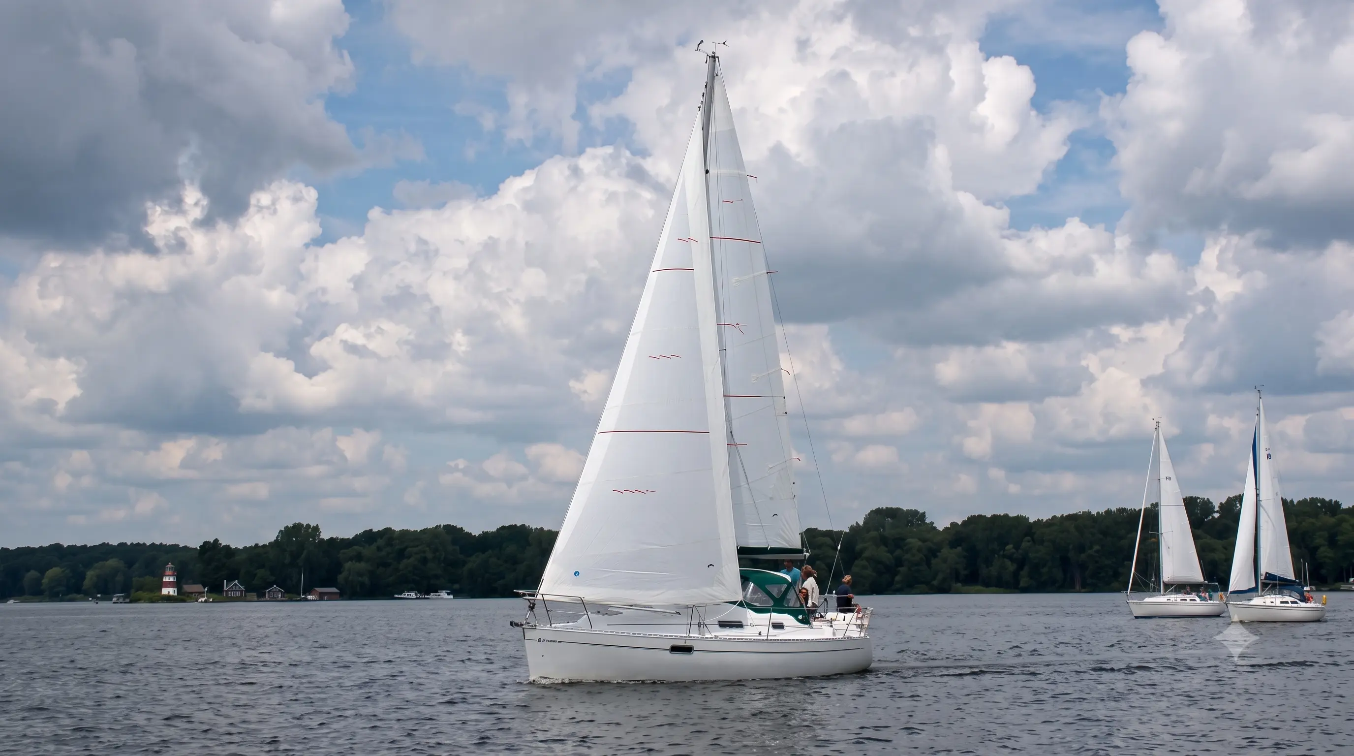 Cruising yacht sailing under a white headsail